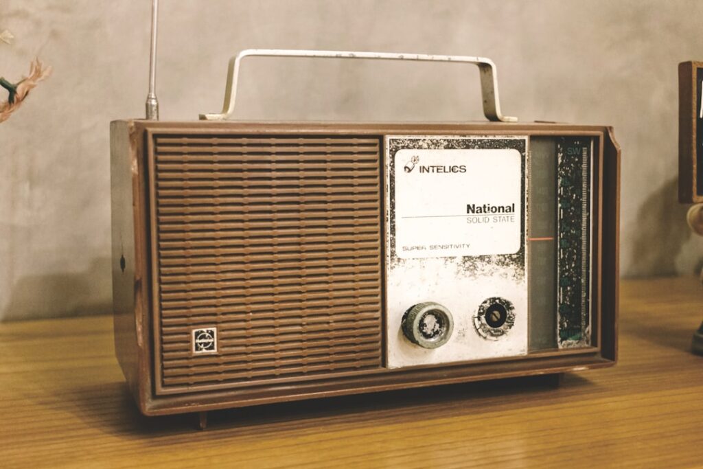A radio sitting on top of a wooden table