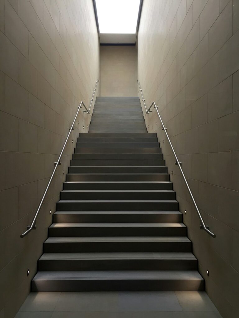 gray concrete stair with gray steel handle